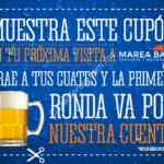 Primera ronda de cervezas gratis en restaurante Marea Baja presentando cupón